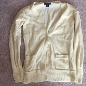 Yellow glittery, two pocket, long sleeve cardigan.